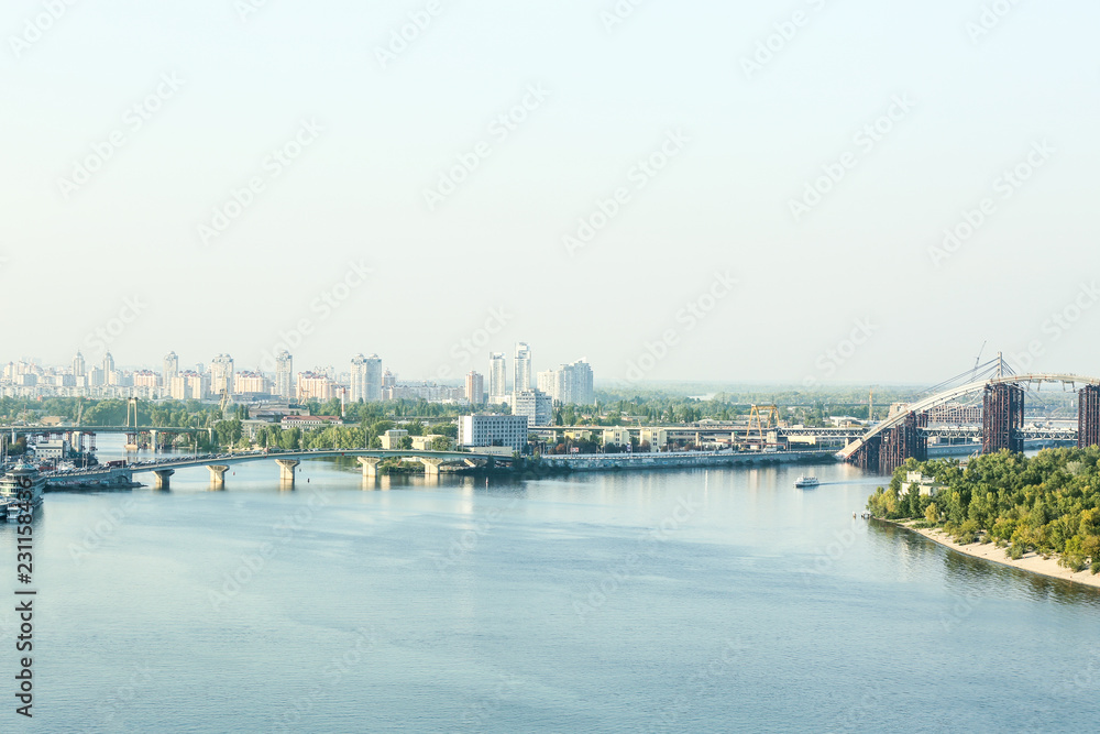 View of beautiful city near river View of beautiful city near river