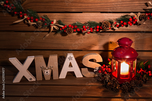 Decoración navidad sobre fondo de madera con farol rojo. photo