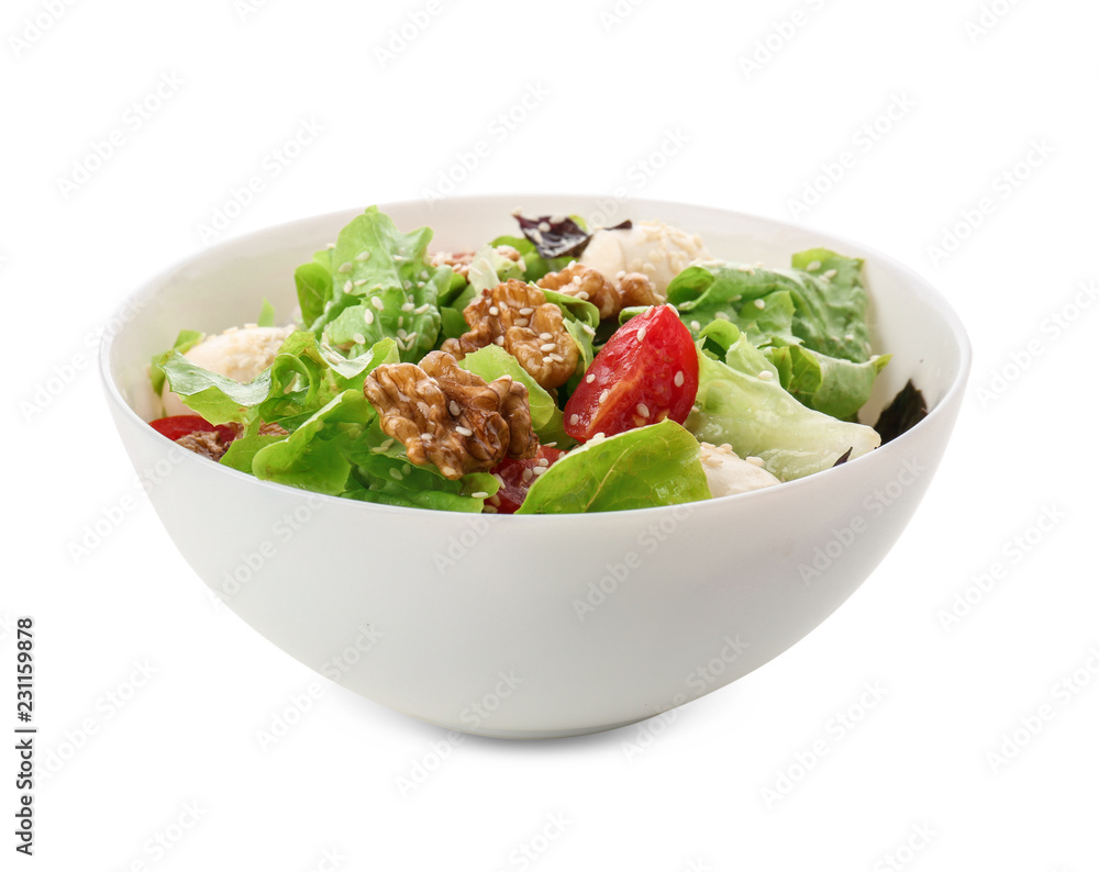 Delicious fresh salad with walnuts in bowl on white background Delicious fresh salad with walnuts in bowl on white background