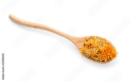 Wooden spoon with dried calendula flowers on white background