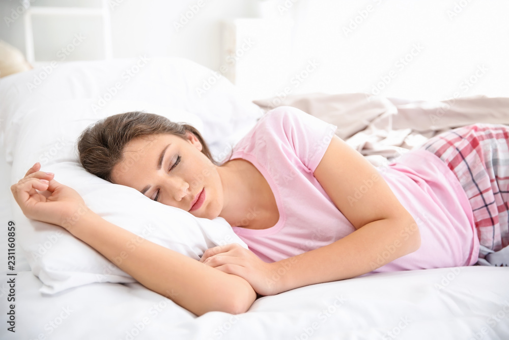Beautiful young woman sleeping in her bed at home Beautiful young woman sleeping in her bed at home