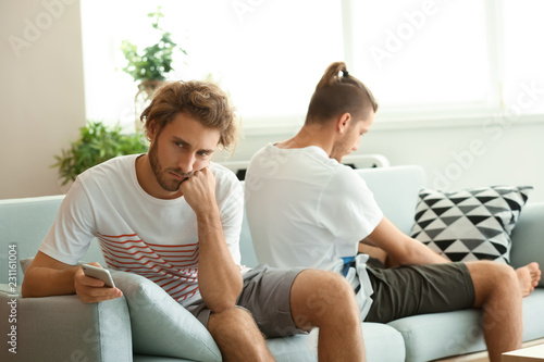Young gay couple in quarrel...