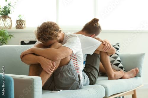 Young gay couple in quarrel...