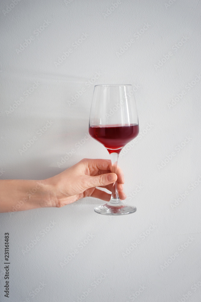 Female hand with glass of red wine on white background Stock Photo ...