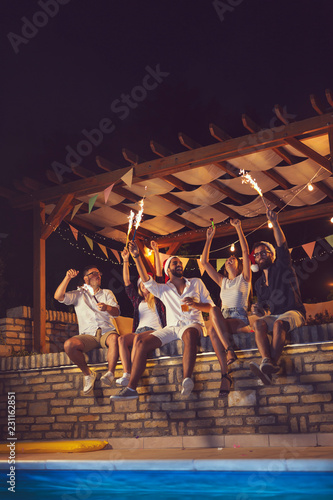 Sticker Friends having fun at poolside New Year's party