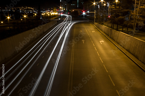 strips from headlights, blurred from cars at night