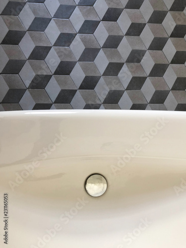 geometric tiles and white washbasin for vintage bathroom