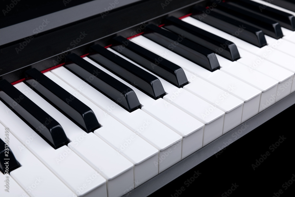 Grand piano keyboard with glossy black and white keys as a music, Select focus and soft focus. Grand piano keyboard with glossy black and white keys as a music, Select focus and soft focus.