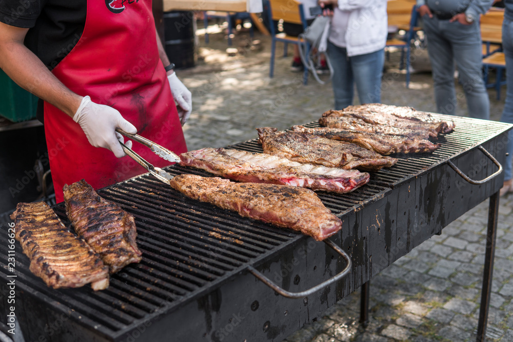 Cooking pork ribs on a grill. Meat on a grills. Cooking pork ribs on a grill. Meat on a grills.