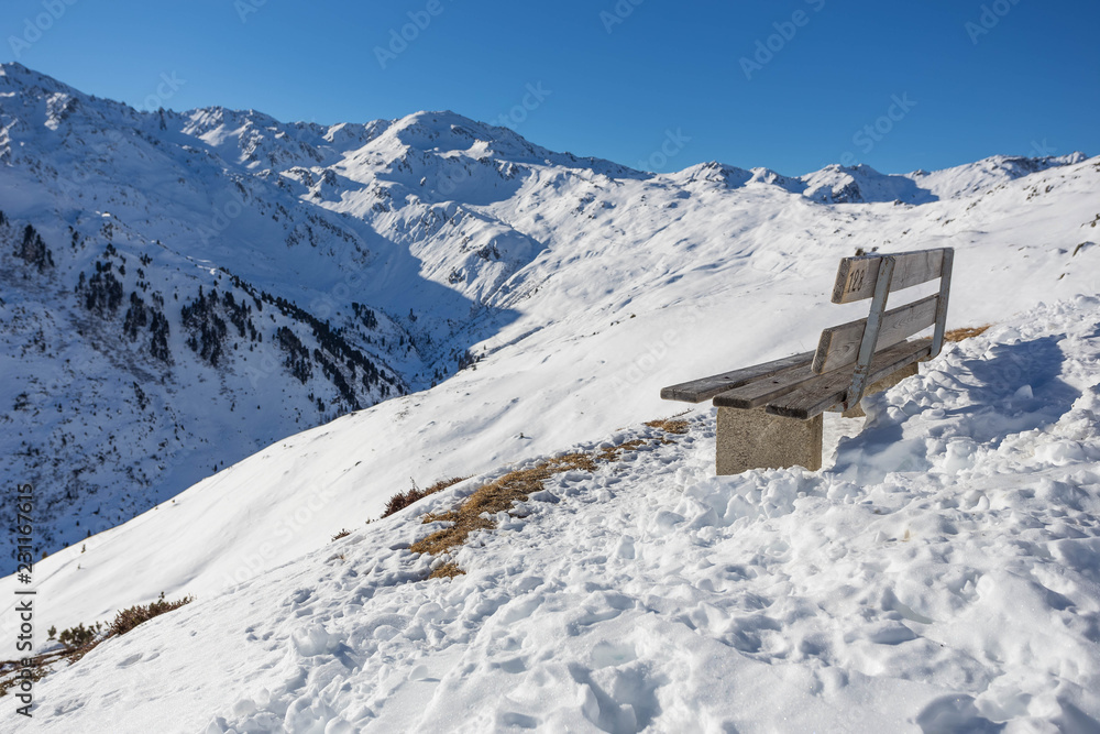 Wintery mountain landscape with sunshine