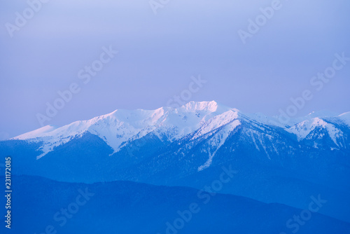 Winter background with a snowy mountain peak © Oleksandr Kotenko