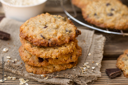 Oatmeal cookies with chocolate served with milk