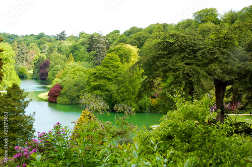 Lake in mature garden in spring