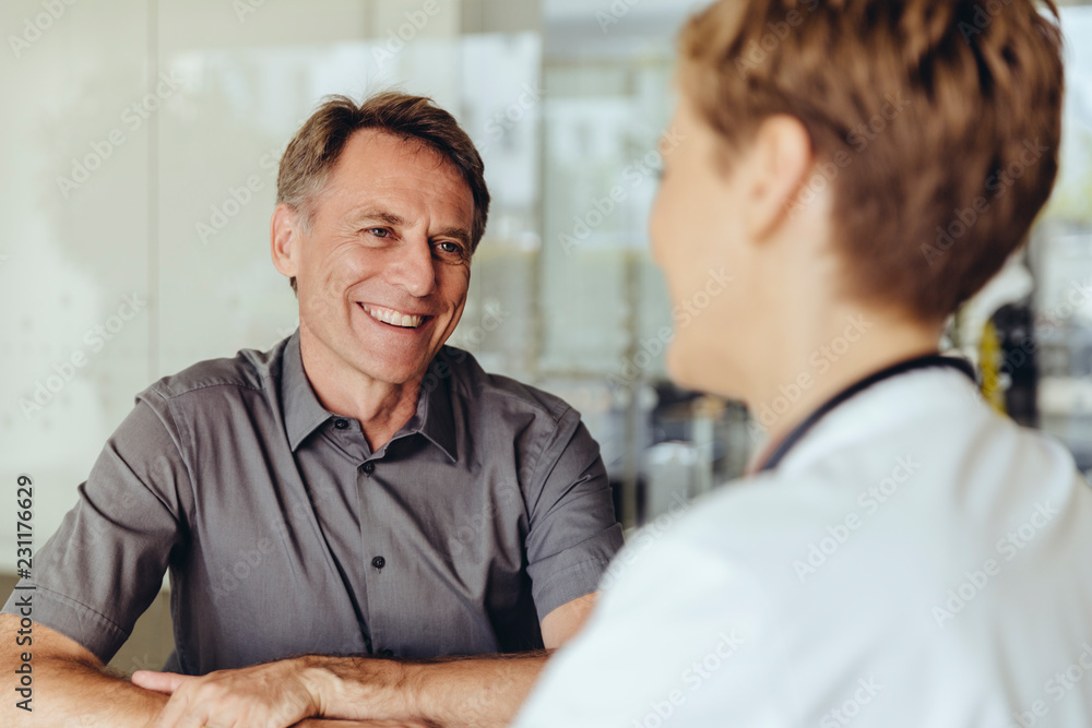 Female doctor talking to patient in practice Female doctor talking to patient in practice