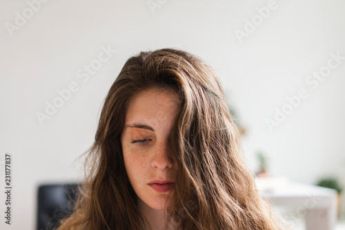 Portrait of brunette young woman at home