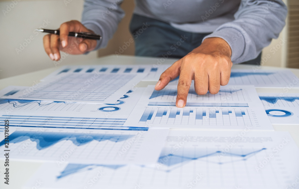 businessman working data document graph chart report marketing research development planning management strategy analysis financial accounting. Business office concept. businessman working data document graph chart report marketing research development planning management strategy analysis financial accounting. Business office concept.