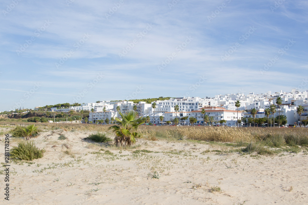 View from the beach to the Spanish city of Conil de la frontera in Andalucia View from the beach to the Spanish city of Conil de la frontera in Andalucia