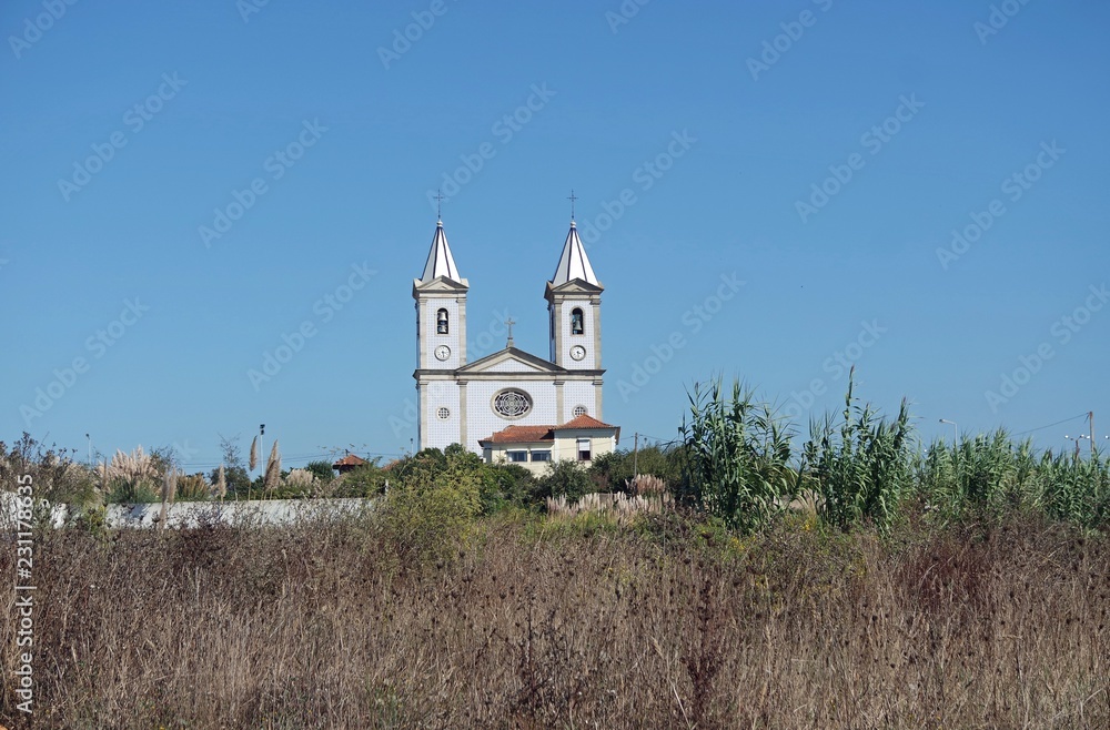 small christian chapel in a village in portugal