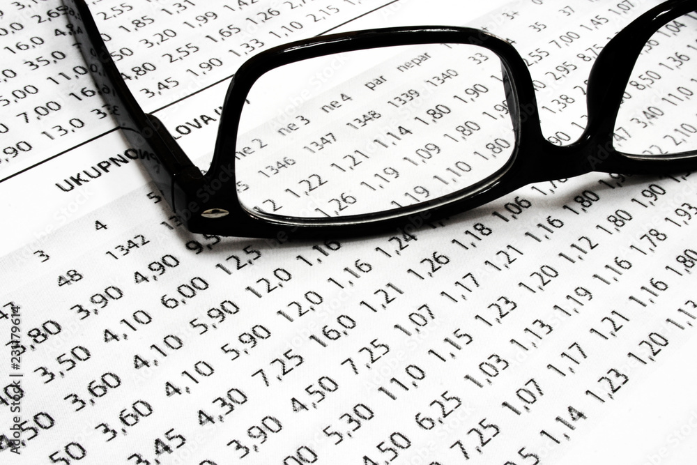 A sport betting list with glasses A sport betting list with glasses