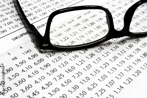 A sport betting list with glasses