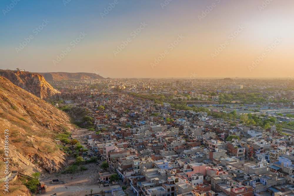 Aerial view of Jaipur city scape from the sun temple view point near Galtaji Temple or the Monkey Palace in senset moment, Jaipur, Rajasthan, India
