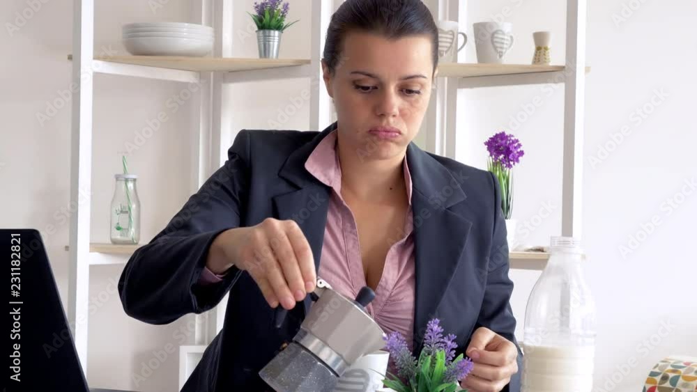 Business woman at home drinking coffee in the morning while working with pc Business woman at home drinking coffee in the morning while working with pc
