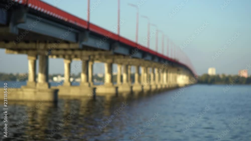 Concrete bridge stands on the troubled river. Sky background Concrete bridge stands on the troubled river. Sky background