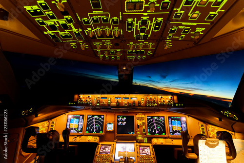 Very beautiful sky view from airplane inside cockpit when airplane fly over the ocean in evening twilight. Seen from the back seat when airplane is turning at high altitude. Modern aviation concept.