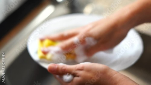 Woman washing a dish