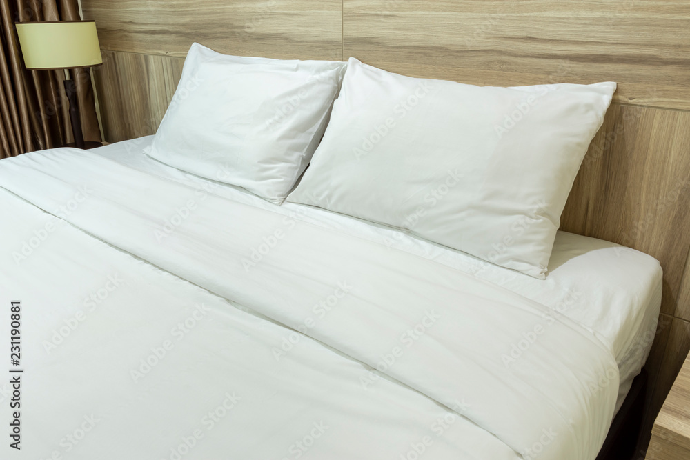 White pillows on a bed Comfortable soft pillows on the bed White pillows on a bed Comfortable soft pillows on the bed