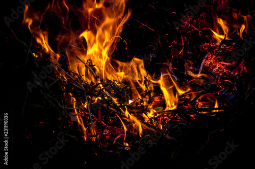 Bright fire on a dark background during a fire_