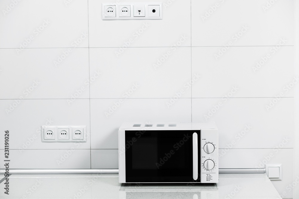 Fototapeta premium Modern kitchen interior with electric and microwave oven