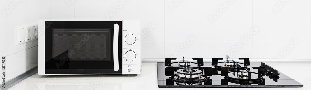 Obraz premium Modern kitchen interior with electric and microwave oven