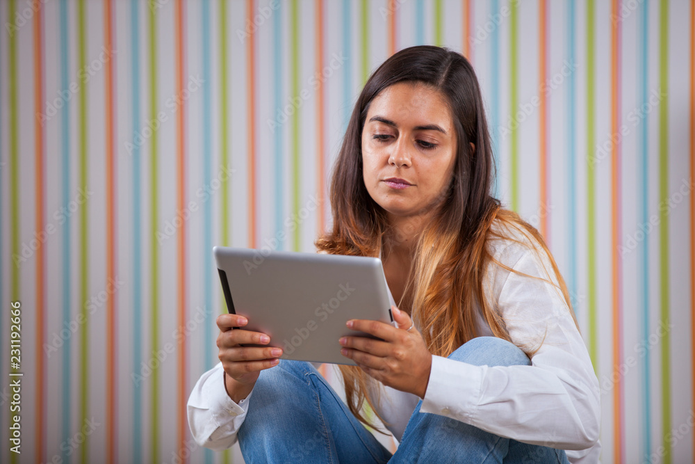 Young woman using a digital tablet Young woman using a digital tablet