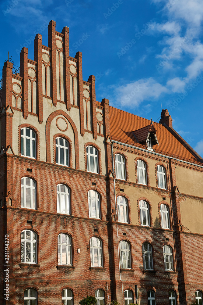 The historic red brick building in the city of Gniezno.