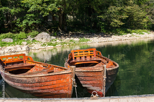Beautiful view of traditional wooden rowing boats on scenic lake