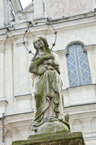 Sculpture of the figure of the Christian saint in the architecture of the old city