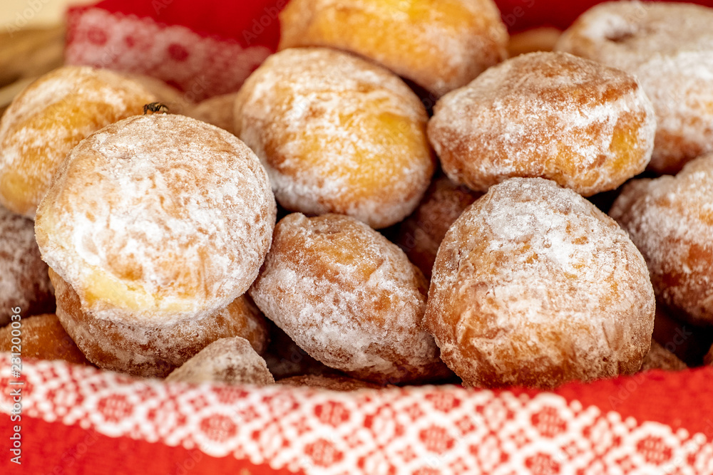 Homemade romanian doughnuts in a basket