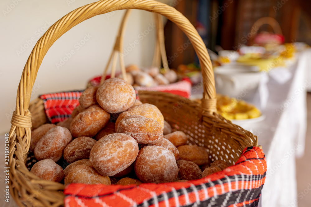 Homemade romanian doughnuts in a basket Homemade romanian doughnuts in a basket