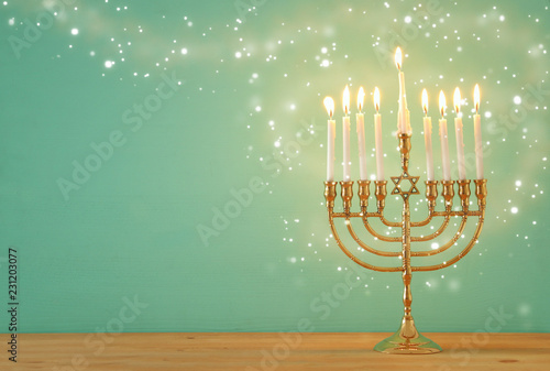 image of jewish holiday Hanukkah background with menorah (traditional candelabra) and candles.