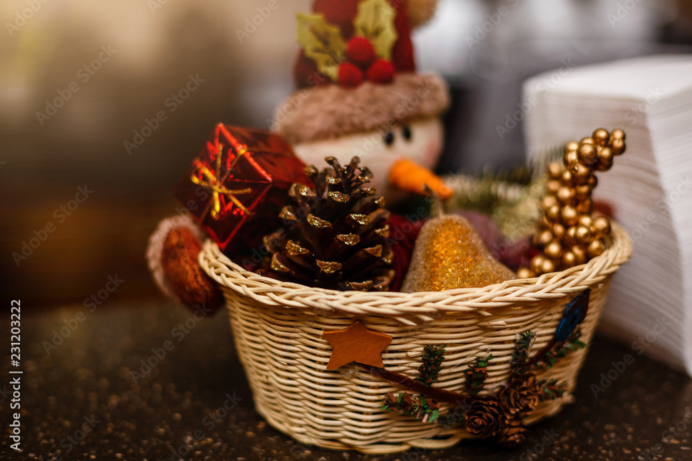 Christmas home decor with pine cones, fruit, and a snowman
