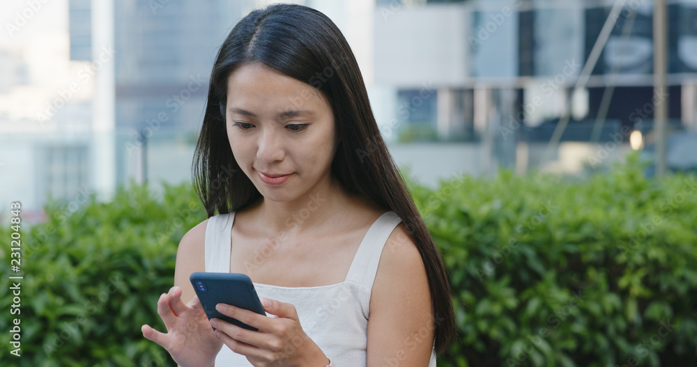 Woman use of smart phone in city Woman use of smart phone in city