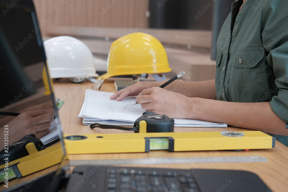 architect engineer working on house blueprint of real estate project at workplace. building construction concept architect engineer working on house blueprint of real estate project at workplace. building construction concept