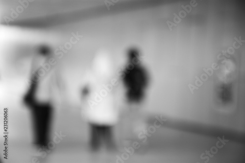 blurred image of people at sidewalk in the city.