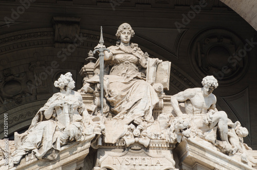 Photography Justice statue at the gates of the roman palace of justice