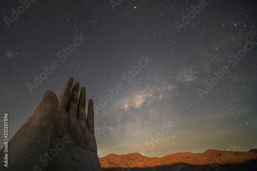 The amazing Mano del Desierto (Desert Hand) with a Milky Way in the southern hemisphere and the Magellan Clouds galaxies with millions of stars around the night sky just amazing. Chile Nightskies
