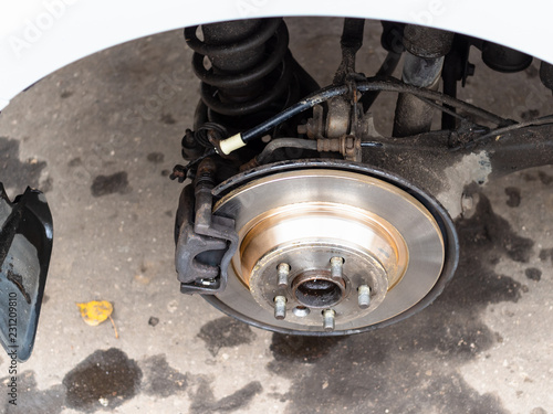 above view of new brake disc on old vehicle