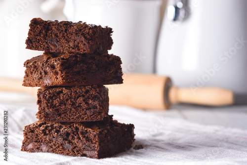 Closeup of a plate of fresh homemade brownies on a white towel photo
