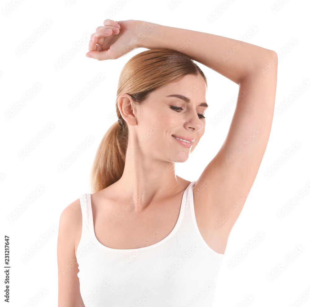 Young woman showing armpit on white background. Using deodorant Young woman showing armpit on white background. Using deodorant