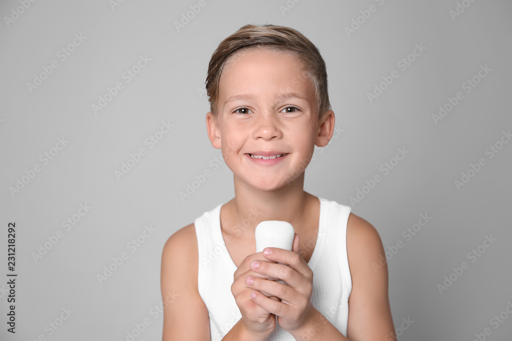 Cute little boy with soap bar on gray background Cute little boy with soap bar on gray background